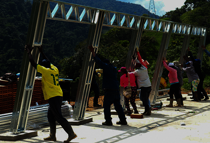 Raising a building frame in rural Colombia